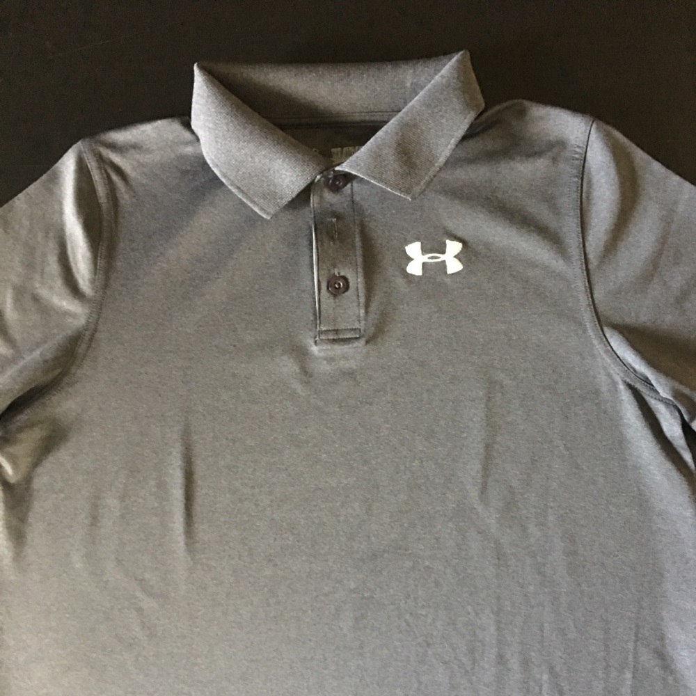 Boys Under Armour dark grey golf shirt.